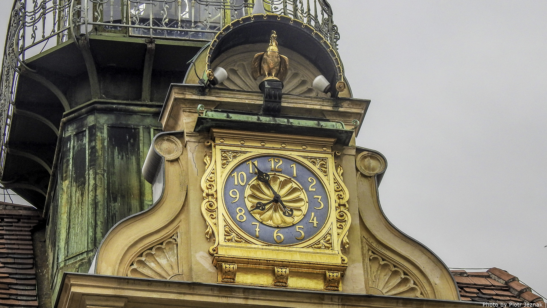 The facade clock of the carillon on the Glockenspielhaus in Graz:
